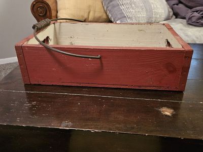 Red rectangular box with metal handle, antique