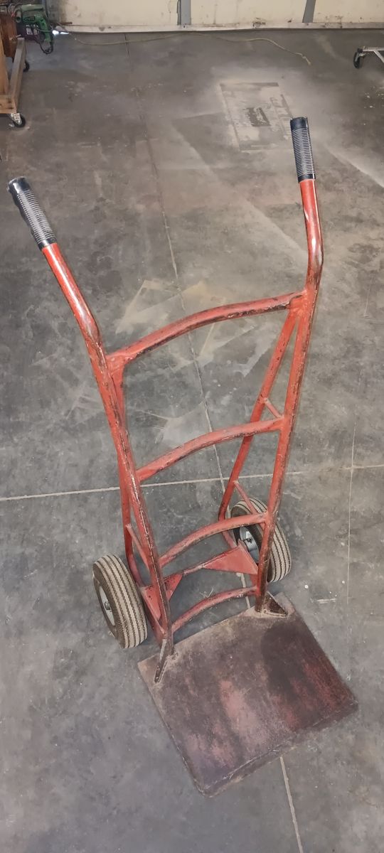Heavy duty, industrial barrel dolly/hand truck with cushioned, inflatable, tube type, air filled tires.