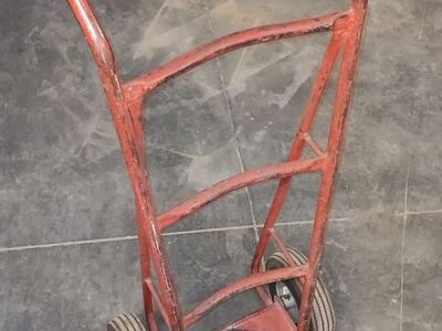 Heavy duty, industrial barrel dolly/hand truck with cushioned, inflatable, tube type, air filled tires.