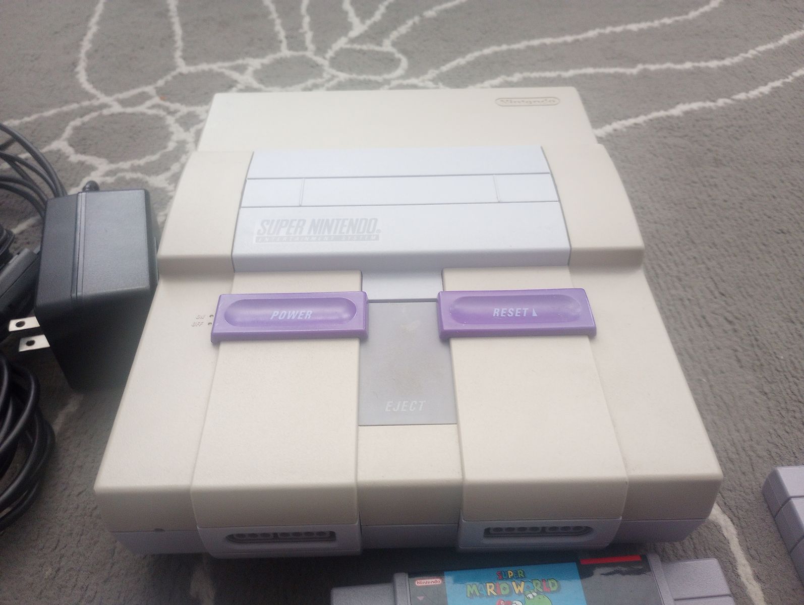 Super Nintendo console, two controllers and 10 games