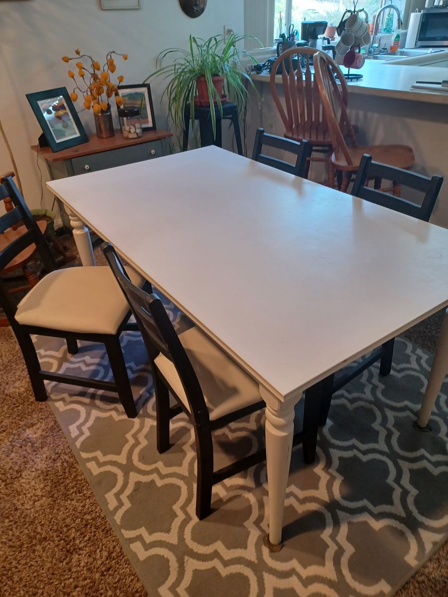Dining table & four chairs.