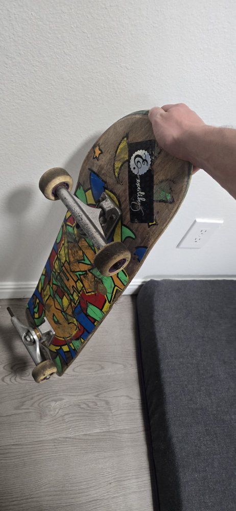 Used Complete Skateboard with Graphic Deck, Metal Trucks, and Wheels