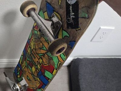 Used Complete Skateboard with Graphic Deck, Metal Trucks, and Wheels