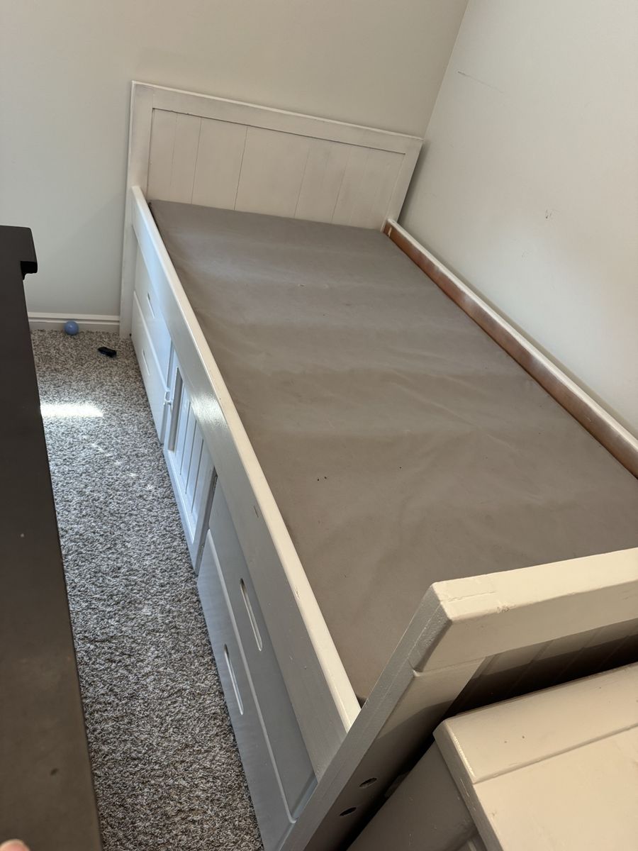 Twin bed with storage drawers and desk