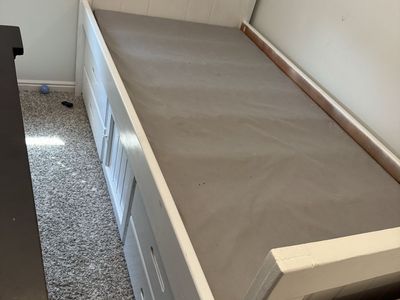 Twin bed with storage drawers and desk