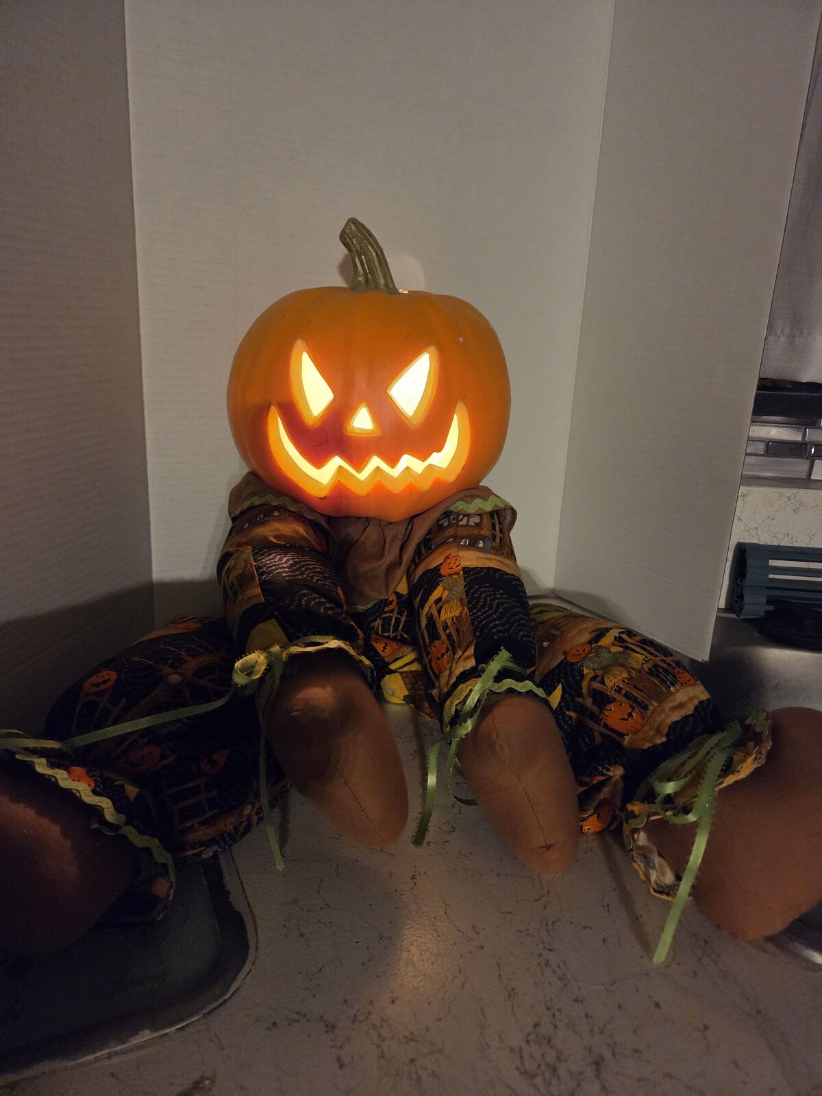 Lighted Halloween pumpkin shelf sitter doll