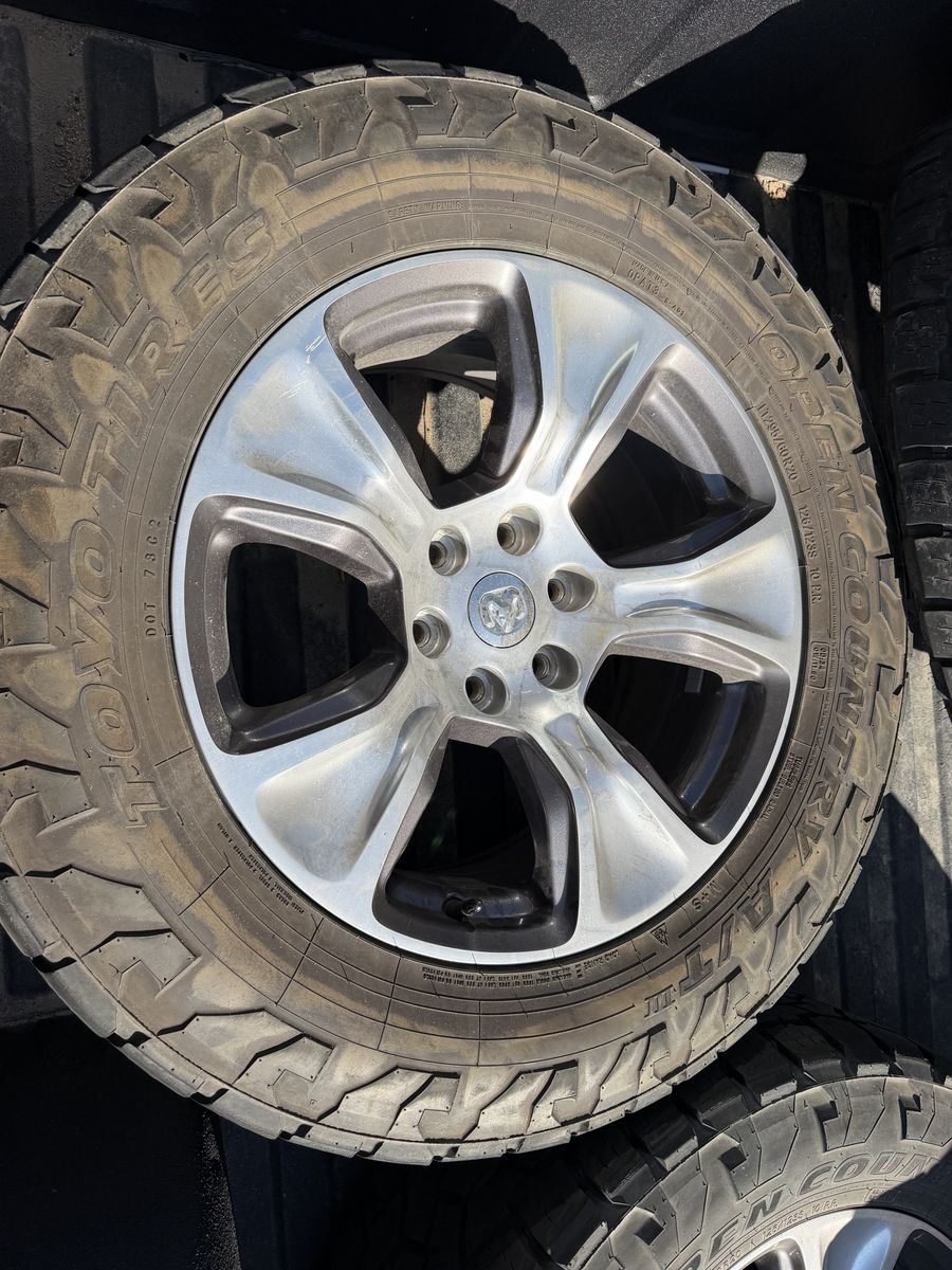 Used Ram Factory Wheels & Toyo Open Country A/T III Tires