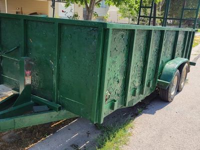 Heavy-Duty Green Utility Trailer with Dual Axles - Great for Hauling, Landscaping, and Debris Removal