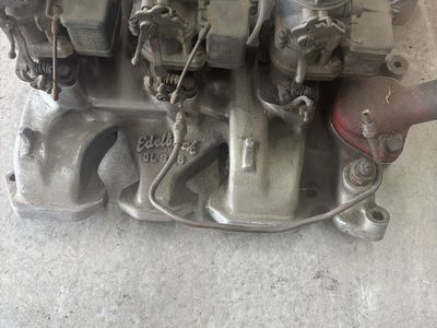 Vintage edelbrock olds tripower intake and carbs
