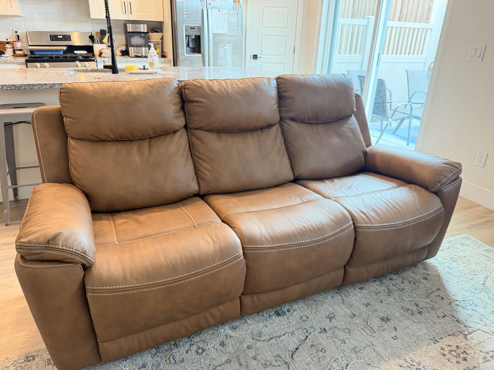 Brown faux leather reclining sofa and loveseat 