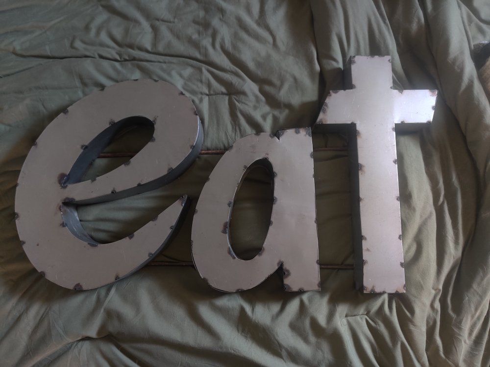 "EAT" metal sign