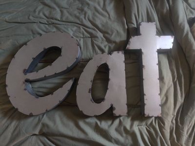 "EAT" metal sign
