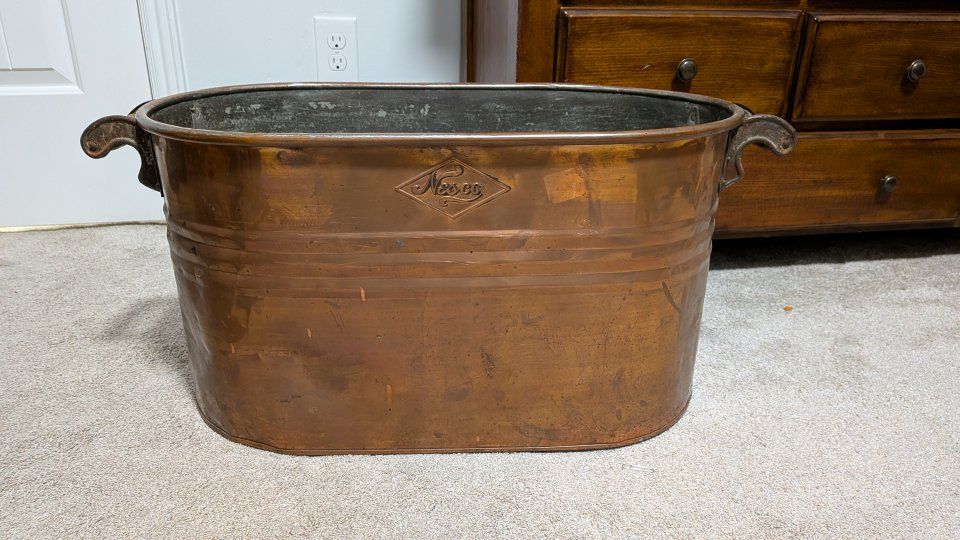 antique copper wash basin with intact wood handles