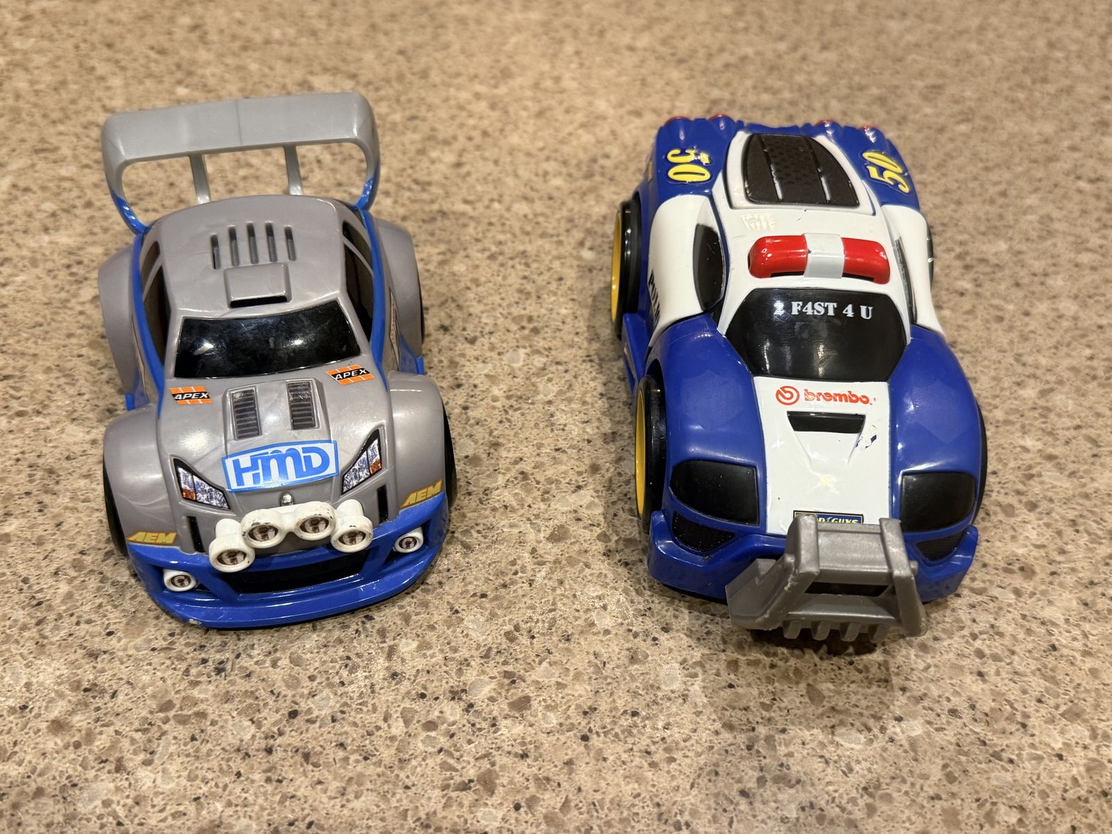 Two Fisher Price Shake N Go Cars