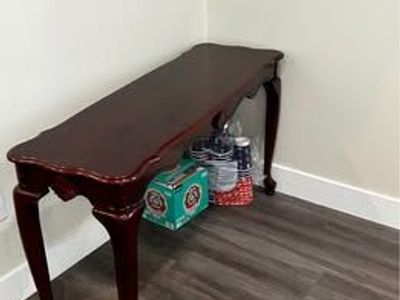 Elegant Wood Console Table with Cherry Finish, Cabriole Legs, and Scalloped Apron