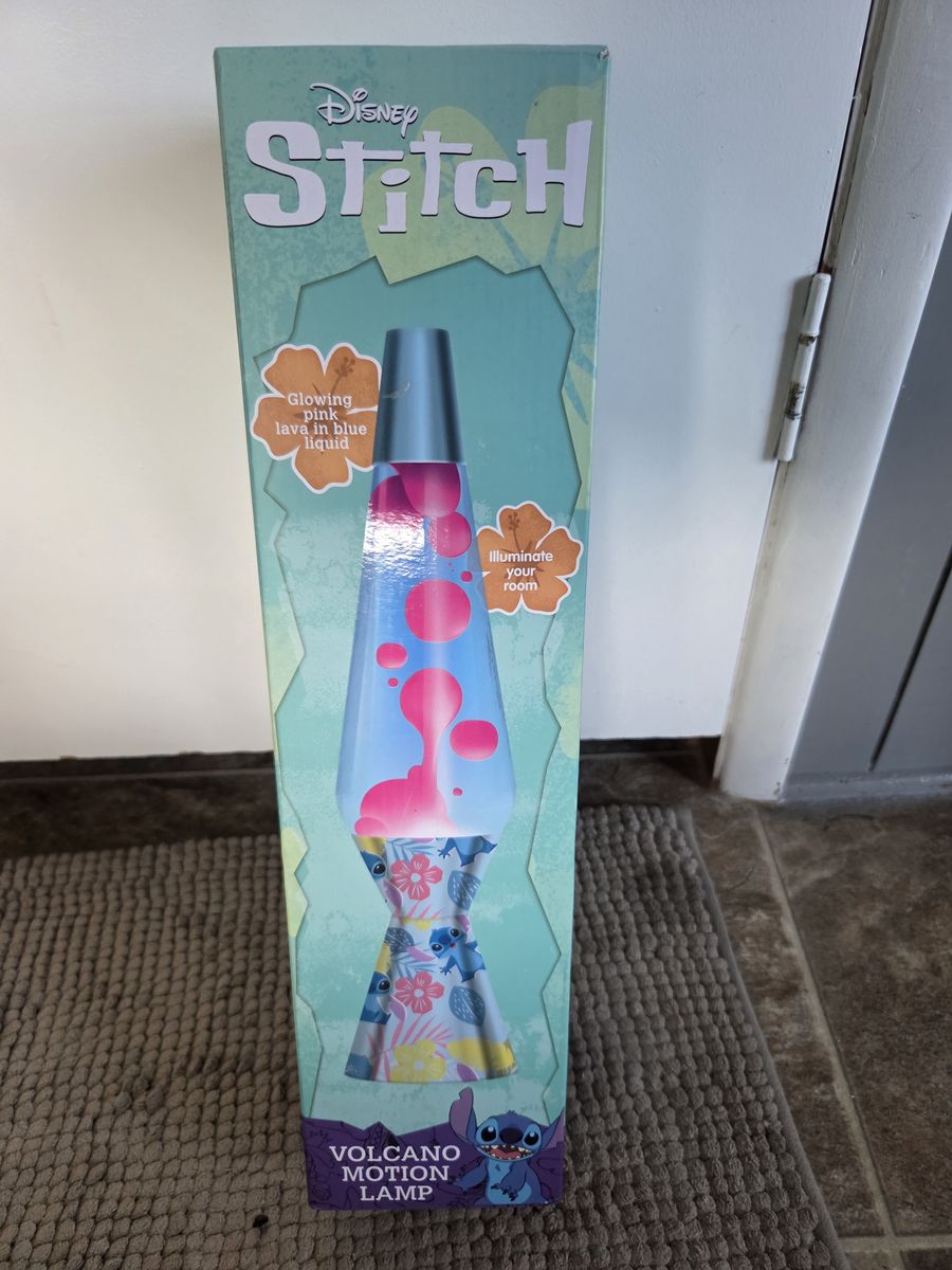 Brand new Disney Stitch Volcano Motion Lava Lamp featuring pink wax in blue liquid
