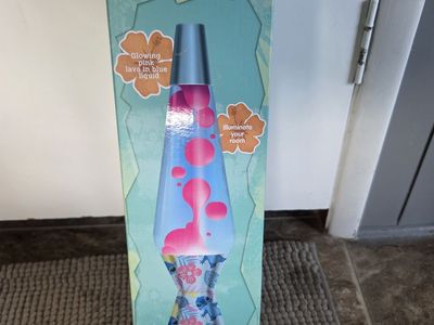 Brand new Disney Stitch Volcano Motion Lava Lamp featuring pink wax in blue liquid