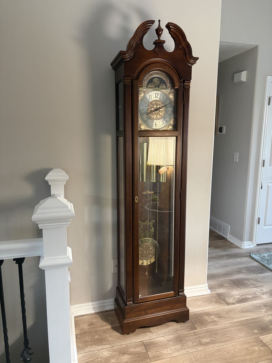 Howard Miller Grandfather Clock, Cherry Wood, Brass Pendulum, Moon Phase Dial