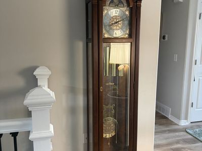 Howard Miller Grandfather Clock, Cherry Wood, Brass Pendulum, Moon Phase Dial