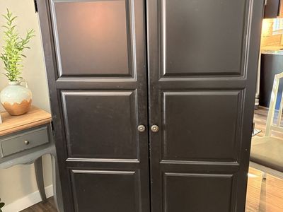 Black Wooden Armoire Wardrobe Cabinet with Two Doors and Drawers. Solid wood.
