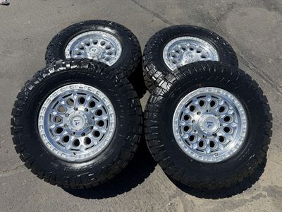 New LT295/70r18 Nitto Ridge Grappler Silver Fittipaldi FT101 8x180 Chevy GMC Duramax 2011+ Silverado Sierra wheels and tires 8