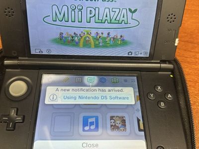 Nintendo 3DS XL Blue Handheld Gaming Console with Two DS Games & Carrying Case
