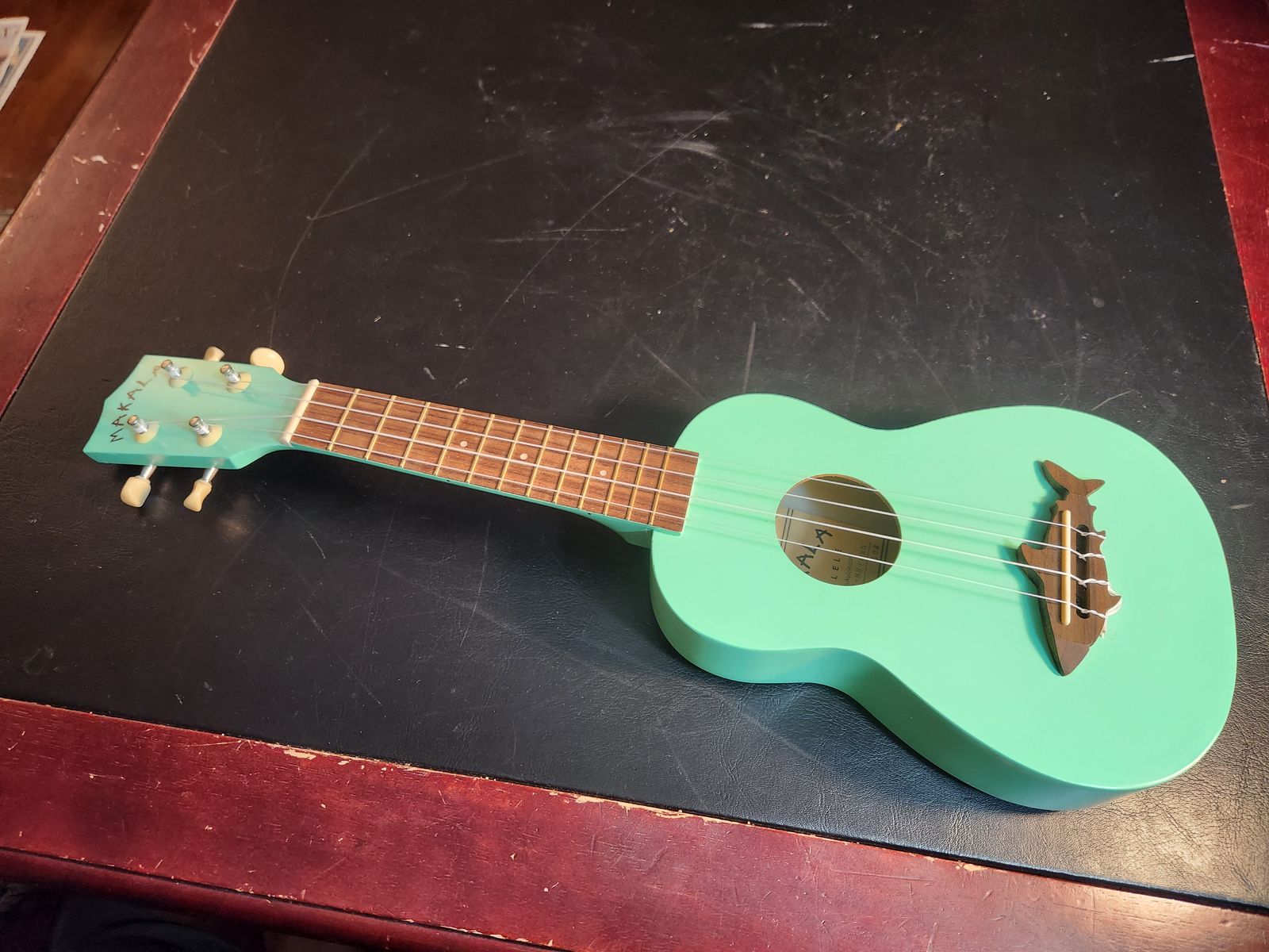 Makala seafoam green soprano ukulele Model MK-SS-GRN.  Has the cool shark bridge.  Perfect shape, sounds great.