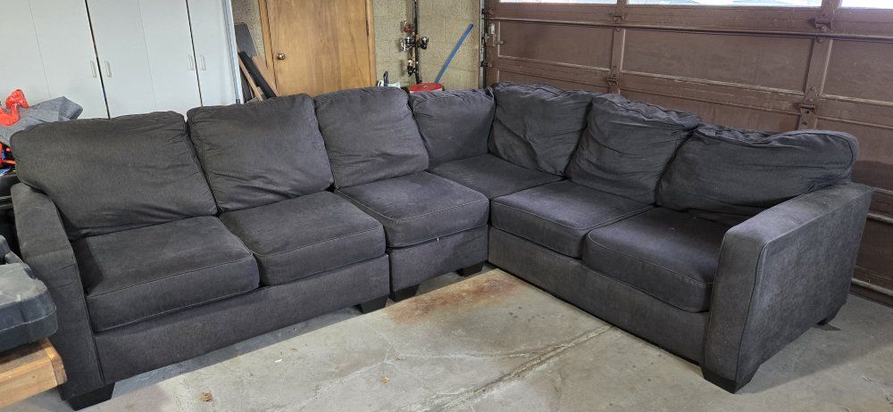 large l shaped dark blue couch.