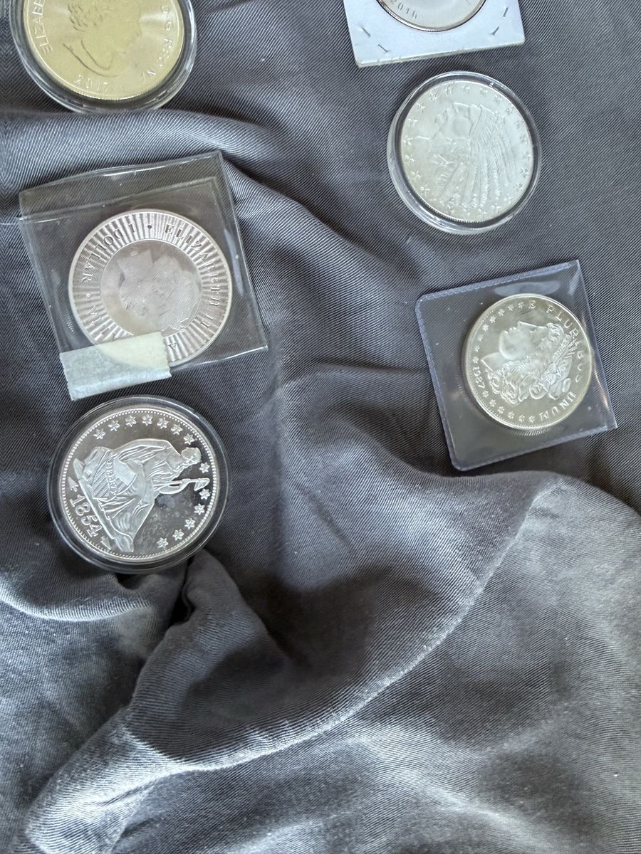 Silver Coins  20 ounces:  1 dollar below spot