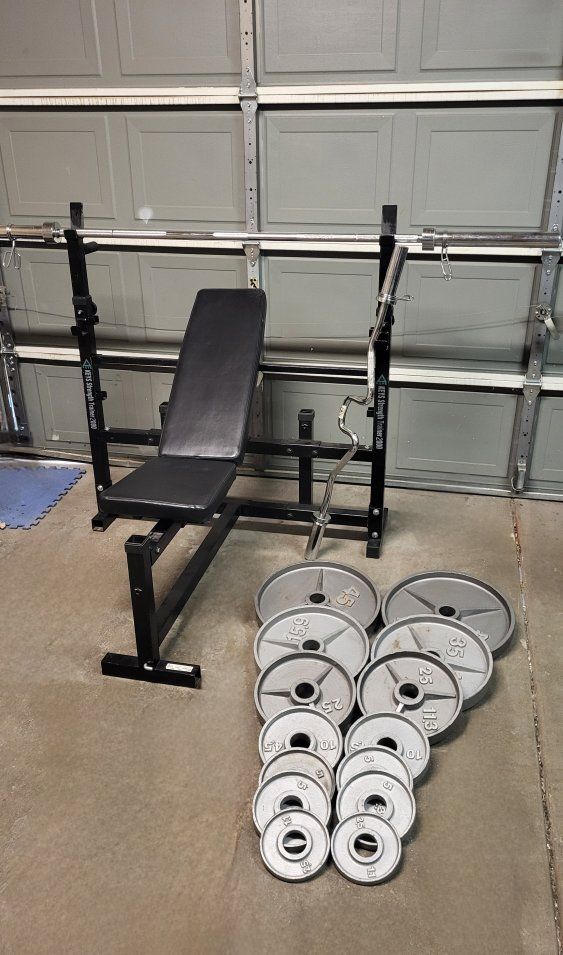 Bench and 255 pounds of weights