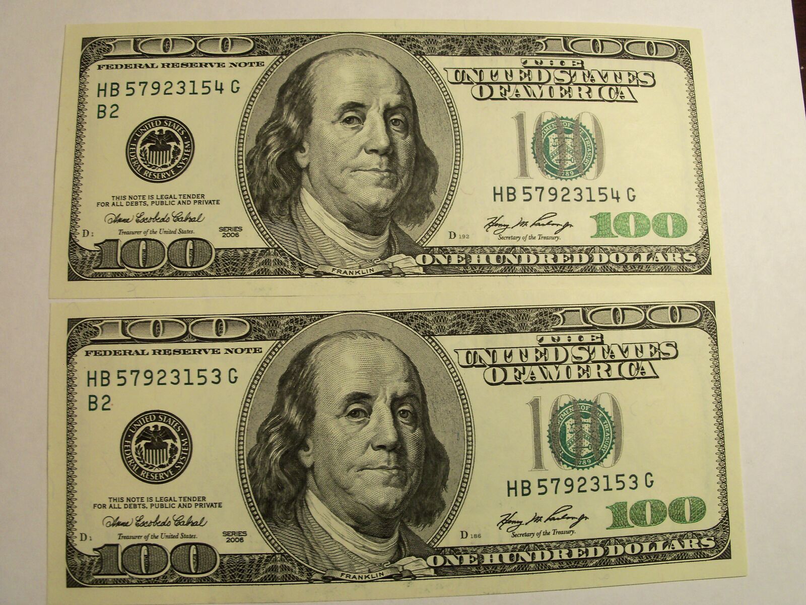 Two each series 2006 $100.00 bills with consecutive numbers, uncirculated