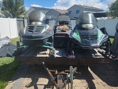 3 snowmobiles and trailer combo