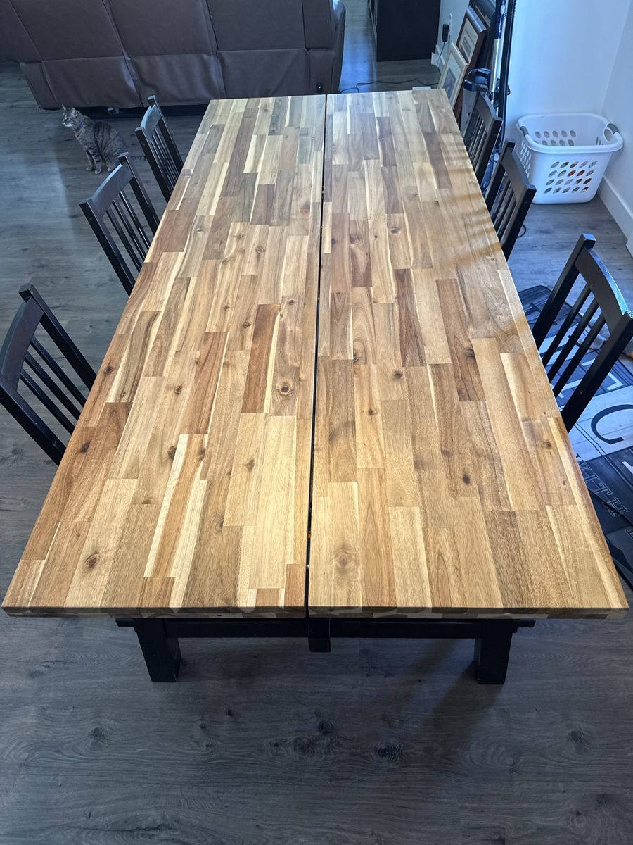 Large Wooden Dining Table with Black Base and Chairs