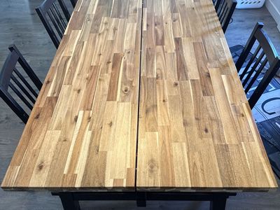 Large Wooden Dining Table with Black Base and Chairs