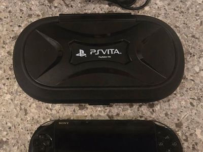 Ps Vita Slim with hard case! trades considered!