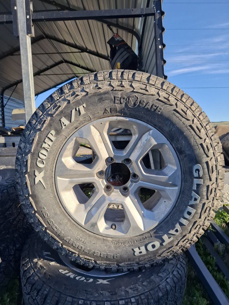 Gladiator X COMP A/T LT235/70R17 All-Terrain Tires and Wheels - Set of 4