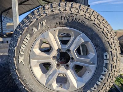 Gladiator X COMP A/T LT235/70R17 All-Terrain Tires and Wheels - Set of 4
