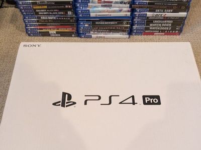Sony PlayStation 4 Pro with Large PS4 Video Game Collection - Used - great condition