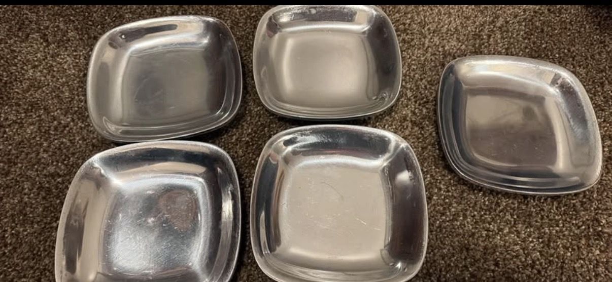 Set of five metal plates/shallow bowls