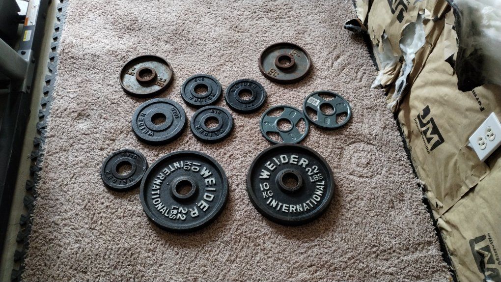 assorted olympic Weight Plates.