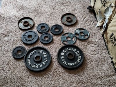 assorted olympic Weight Plates.