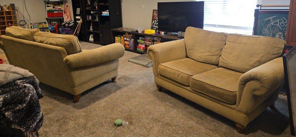 Matching Tan Fabric Sofa and Loveseat Set with Rolled Arms