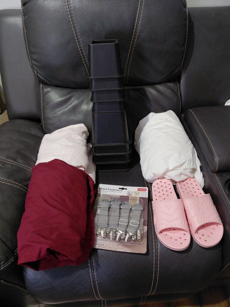 BUNDLE: Assorted Home Items: Bed Risers, 2 Meloni Sheets pink and red wine, 1 new mattress encasement, Sheet Fasteners, and slip