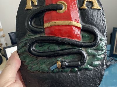 Cast iron fire insurance mark plaque with 'FA' lettering and fire hydrant motif