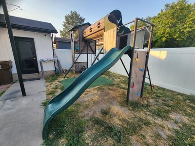 Lifetime Outdoor Playset with Rock Wall, Crawl Tunnel, slide and swings .