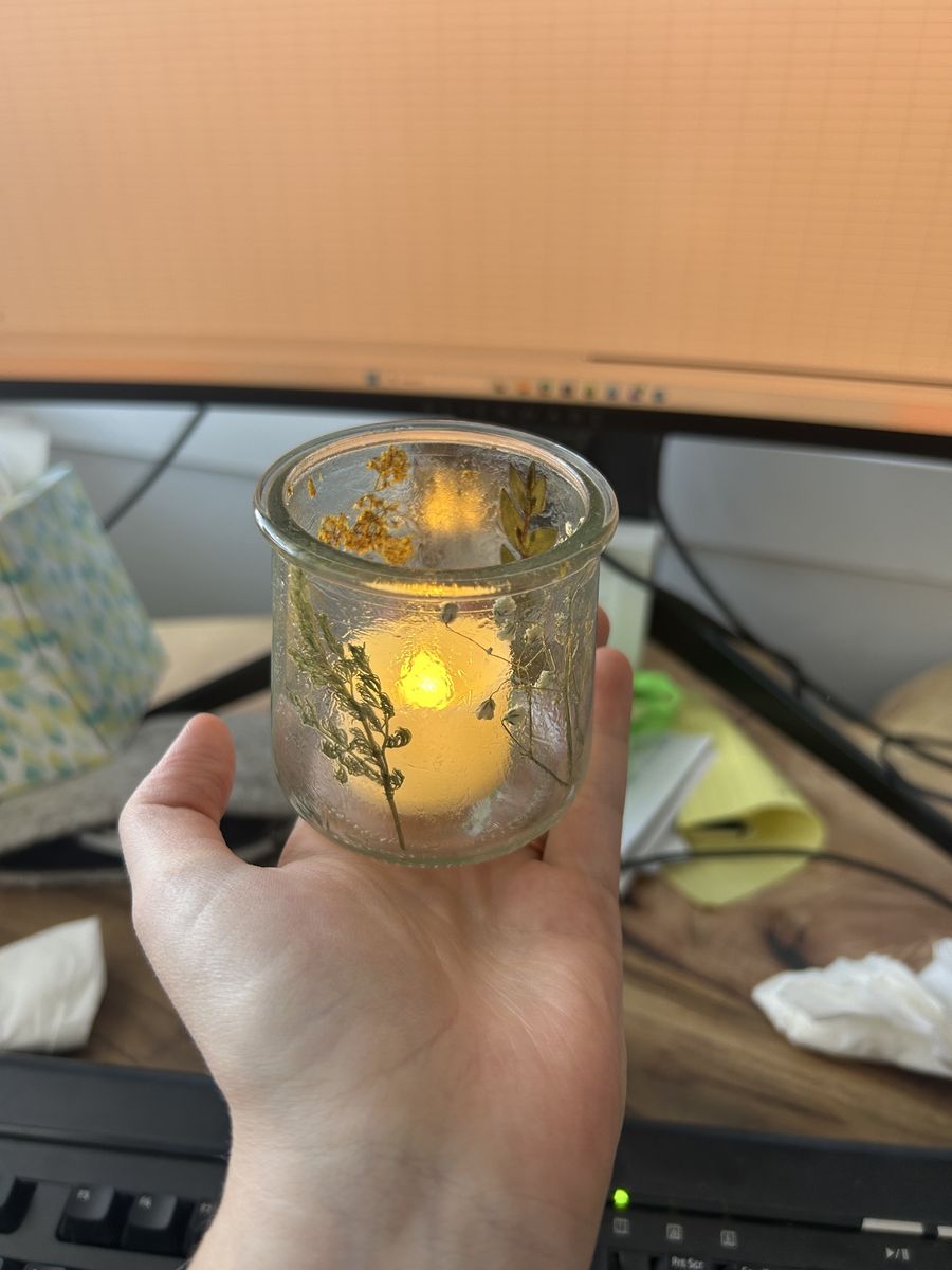 Tea candles and dried floral vases