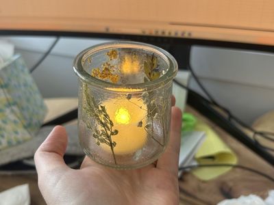 Tea candles and dried floral vases