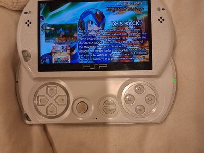 Pearl White PSPGo with a few downloaded games