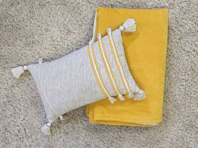 corduroy blanket and tassel pillow