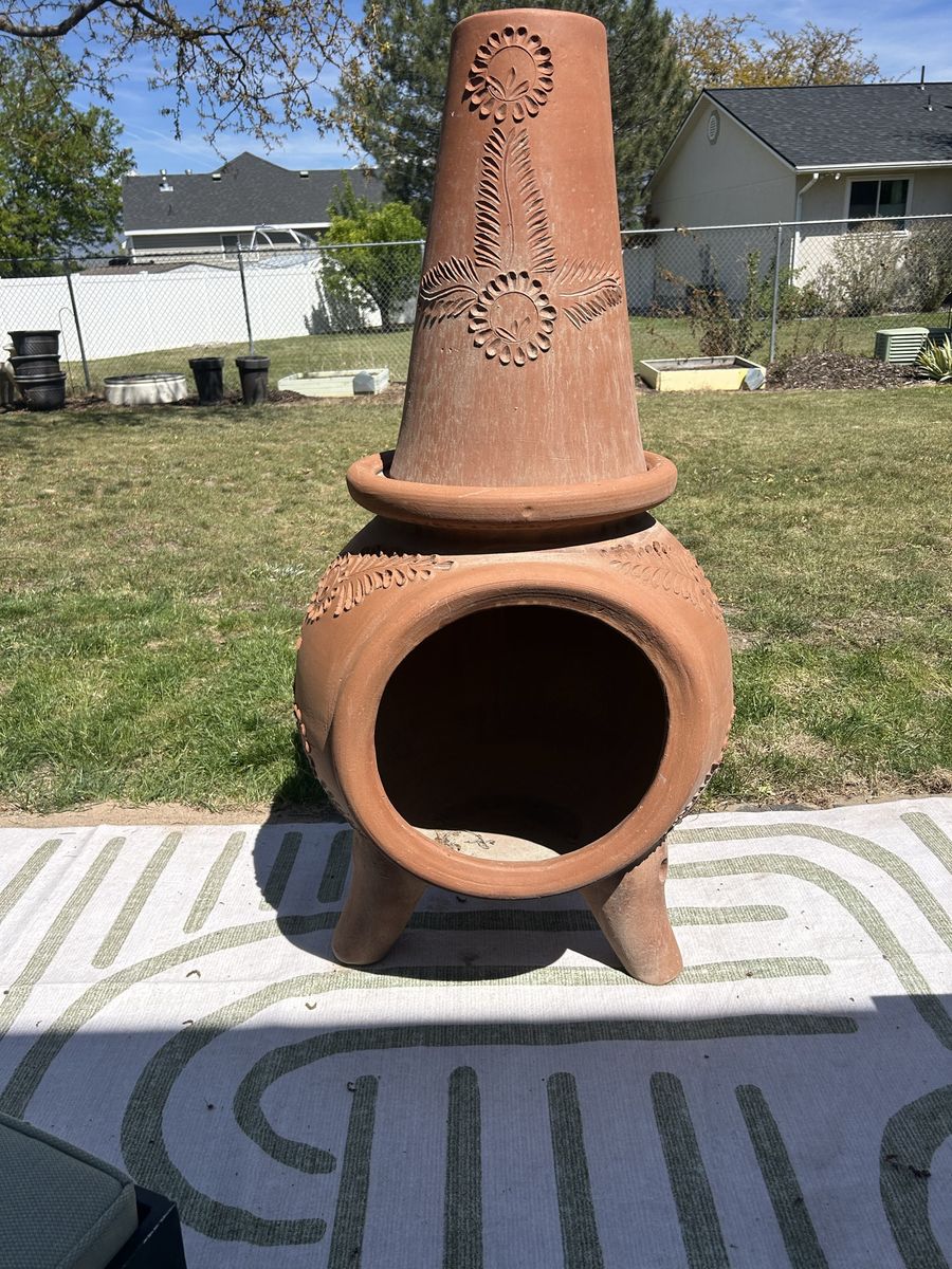 Mexican-style terracotta chiminea (outdoor fireplace)
